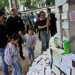 Число погибших при пожаре возросло до 146 после того, как полиция Гонконга обыскала четыре высотных здания